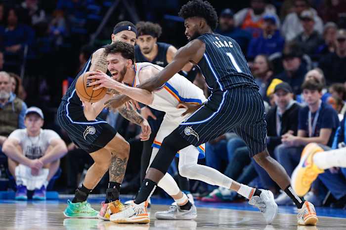Orlando Magic's Jonathan Isaac (1) reaches in against Oklahoma City Thunder's Chet Holmgren.